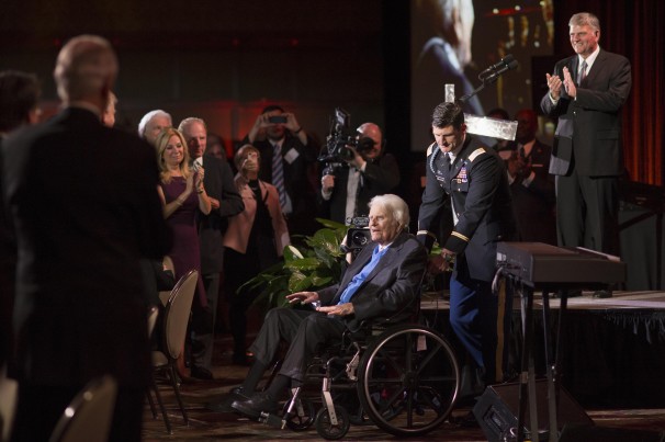 The Rev. Billy Graham arrives at his birthday party, pushed by his grandson, Edward Graham. (Reuters)